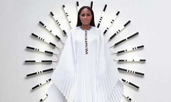 Philanthropic fashion luxury white gown designed by Abeer Al Otaiba of SemSem.
