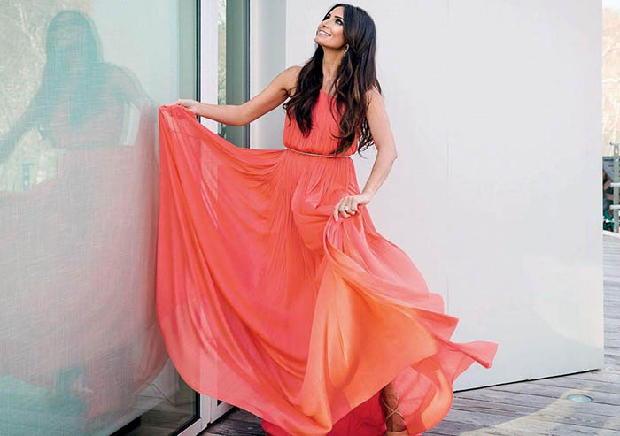 Photo courtesy of Harper’s Bazaar Magazine, Abeer Al Otaiba in a flowing, orange summer dress.