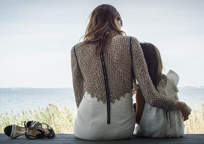 Abeer Al Otaiba and her daughter, Samia, sitting on a deck, photographed as part of SemSem’s Resort 2016 campaign.