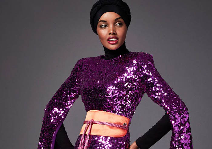 Halima Aden for SemSem Spring 2018, the first hijab-wearing model on the international runway, in a purple sequin gown and hijab.