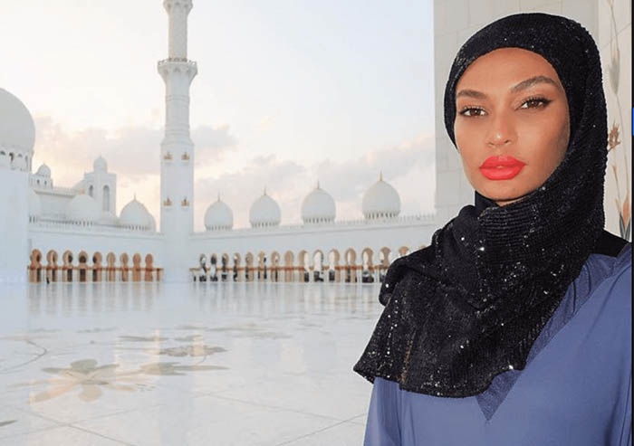 Photo of Joan Smalls in Abu Dhabi at the Sheikh Zayed Grand Mosque, wearing a custom-made SemSem abaya.